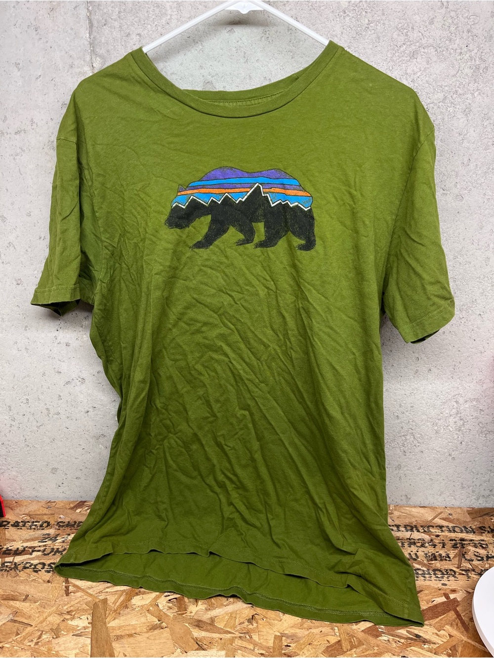 Patagonia Olive Green Short Sleeve Tee with Colorful Bear Graphic
